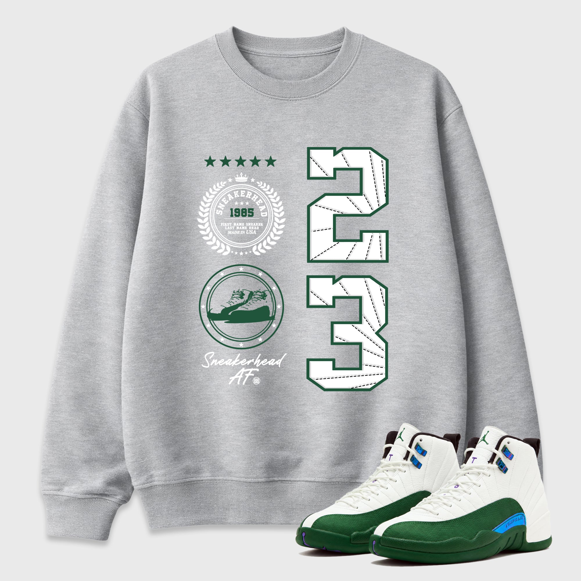 Sneaker Emblem Graphic T-Shirt featuring original streetwear artwork designed to match the Air Jordan 12 Summit Green. Heather Grey 1 Graphic Tee.