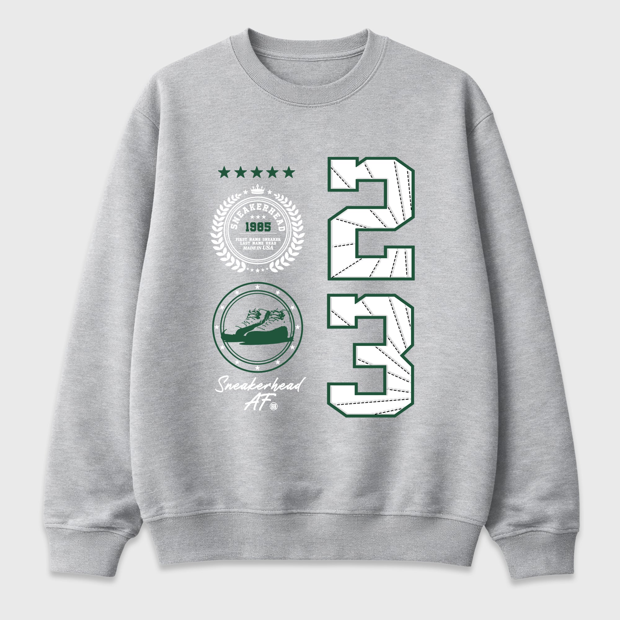 Sneaker Emblem Graphic T-Shirt featuring original streetwear artwork designed to match the Air Jordan 12 Summit Green. Heather Grey 2 Graphic Tee.