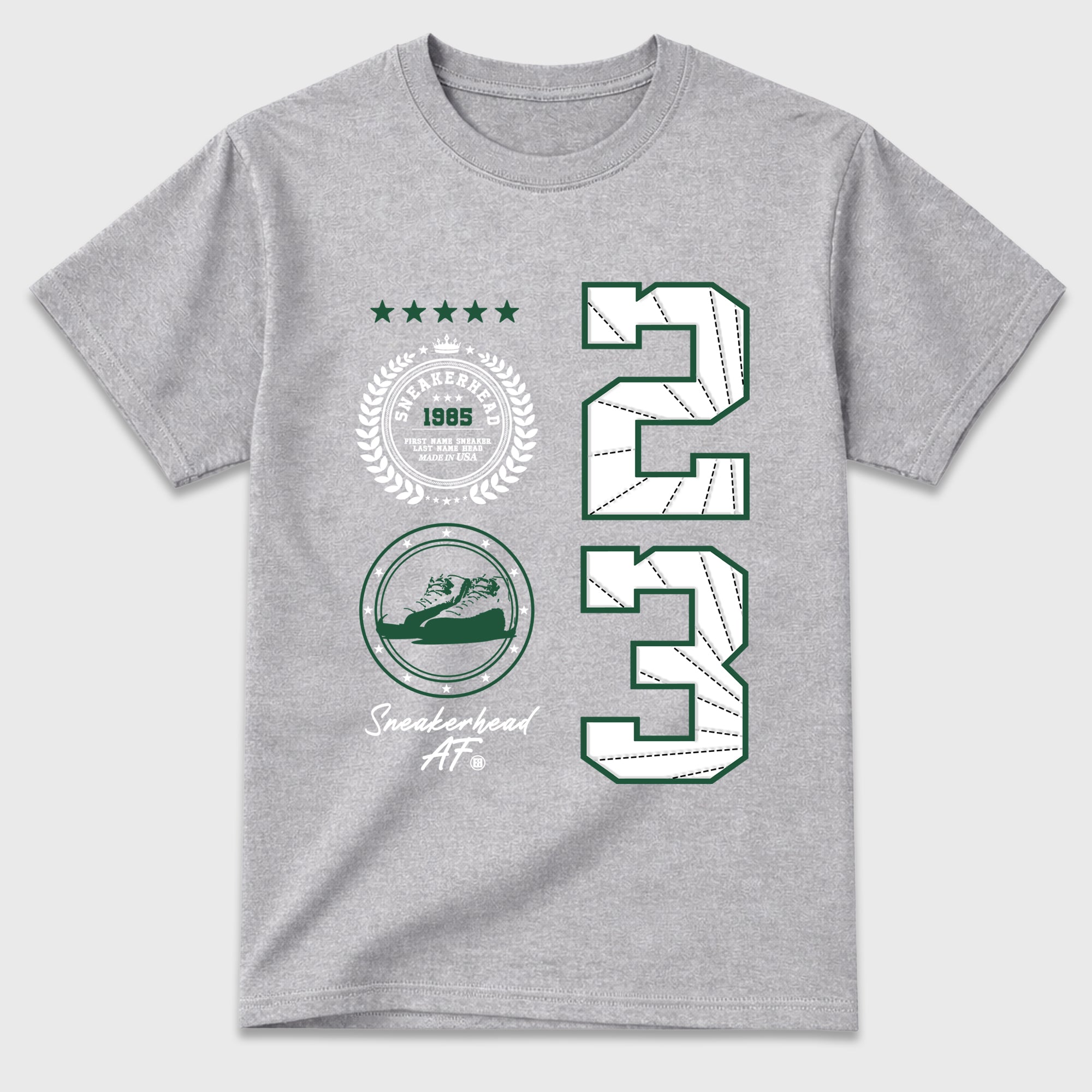 Sneaker Emblem Graphic T-Shirt featuring original streetwear artwork designed to match the Air Jordan 12 Summit Green. Heather Grey 2 Graphic T-Shirt.