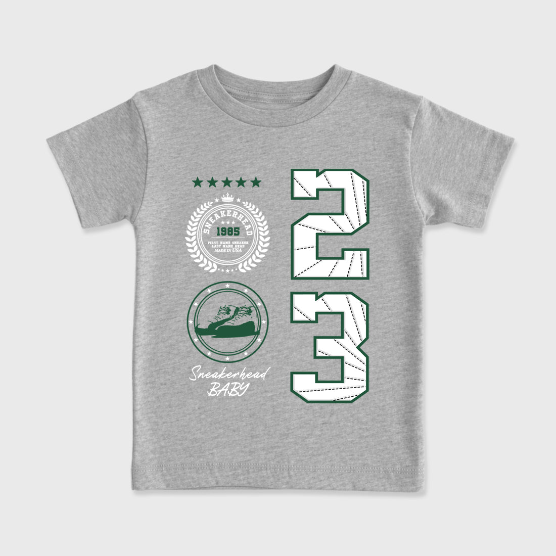 Sneaker Emblem Baby & Kids Graphic T-Shirt featuring original artwork designed to match the Air Jordan 12 Summit Green. Heather Grey 2 Kids Graphic Tee.