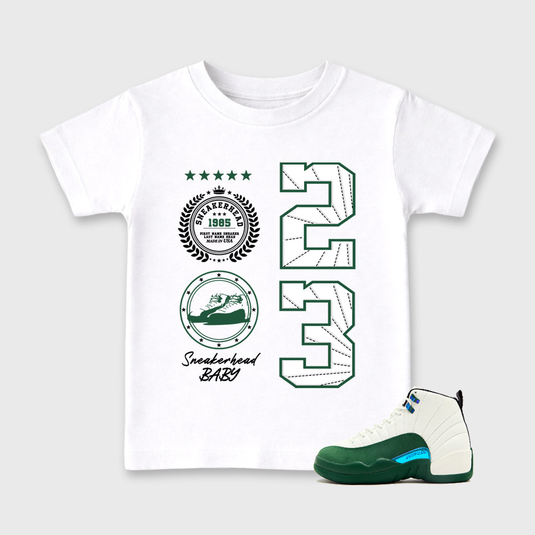 Sneaker Emblem Baby & Kids Graphic T-Shirt featuring original artwork designed to match the Air Jordan 12 Summit Green. White 1 Kids Graphic Tee.