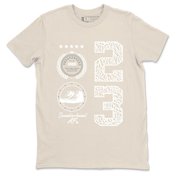 Sneaker Emblem sneaker match t-shirt styled to complete your fit with the Air Jordan 3 Pure Money sneakers, shown in Natural 2.