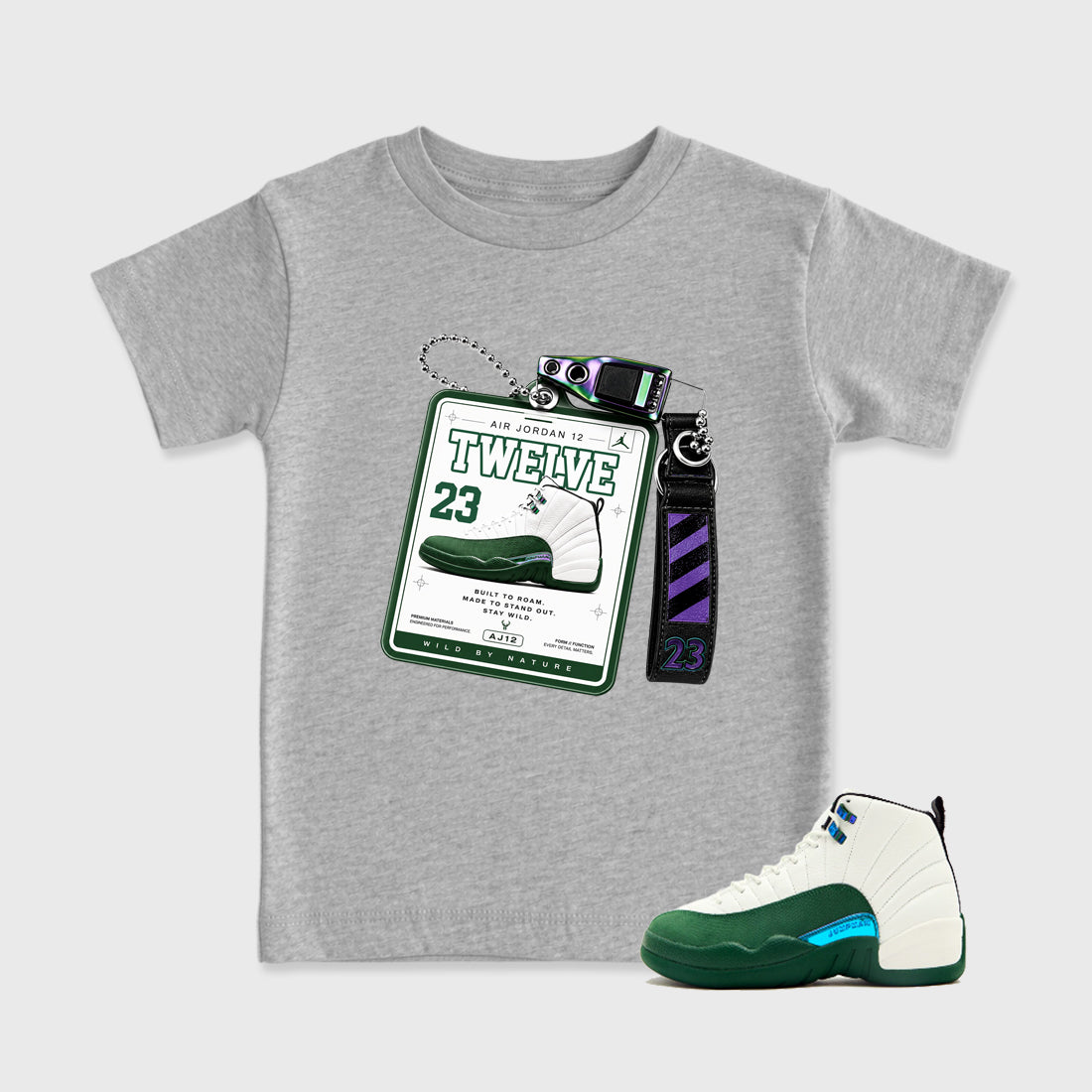 Sneaker Hang Tag Baby & Kids Graphic T-Shirt featuring original artwork designed to match the Air Jordan 12 Summit Green. Heather Grey 1 Kids Graphic Tee.