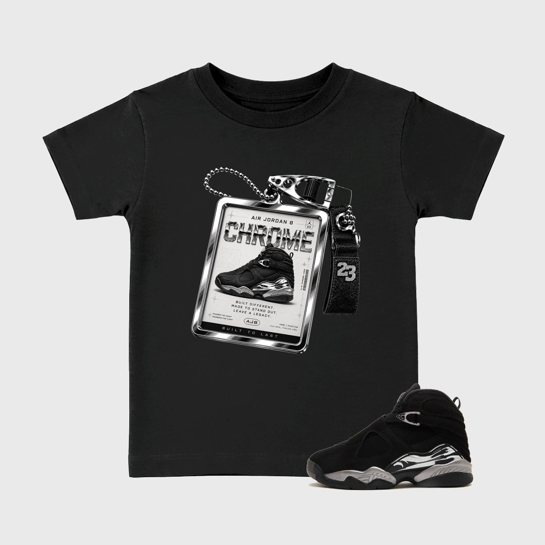 Sneaker Hang Tag Baby & Kids Graphic T-Shirt featuring original artwork designed to match the Air Jordan 8 Chrome. Black 1 Kids Graphic Tee.