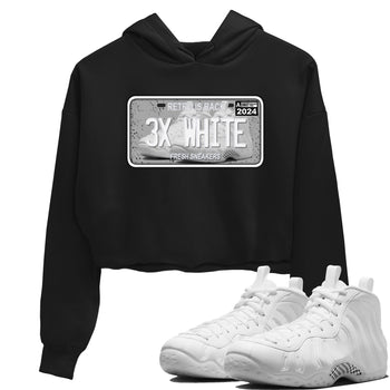 Sneaker Plate womens crop tee made to vibe with the Air Foamposite One Triple White sneakers — the perfect match in Black 1.