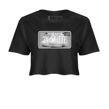 Sneaker Plate womens crop tee made to vibe with the Air Foamposite One Triple White sneakers — the perfect match in Black 2.