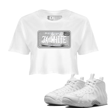 Sneaker Plate womens crop tee made to vibe with the Air Foamposite One Triple White sneakers — the perfect match in White 1.