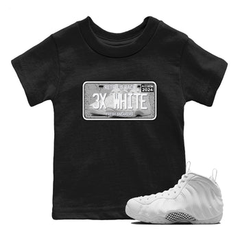 Sneaker Plate baby and kids t-shirt crafted for little sneakerheads to shine with the Air Foamposite One Triple White sneakers, displayed in Black 1.