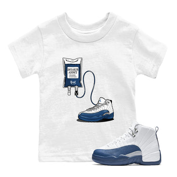 Sneaker Therapy baby and kids t-shirt crafted for little sneakerheads to shine with the Air Jordan 12 French Blue sneakers, displayed in White 1.