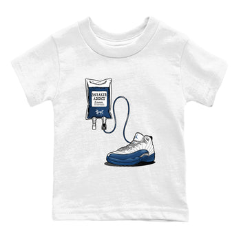 Sneaker Therapy baby and kids t-shirt crafted for little sneakerheads to shine with the Air Jordan 12 French Blue sneakers, displayed in White 2.