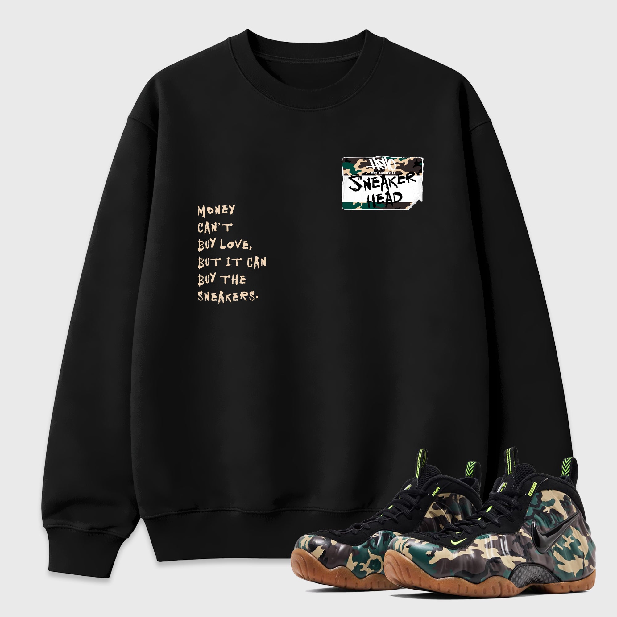 Sneakerhead Badge Graphic T-Shirt featuring original streetwear artwork designed to match the Air Foamposite Pro Green Camo. Black 1 Graphic Tee.