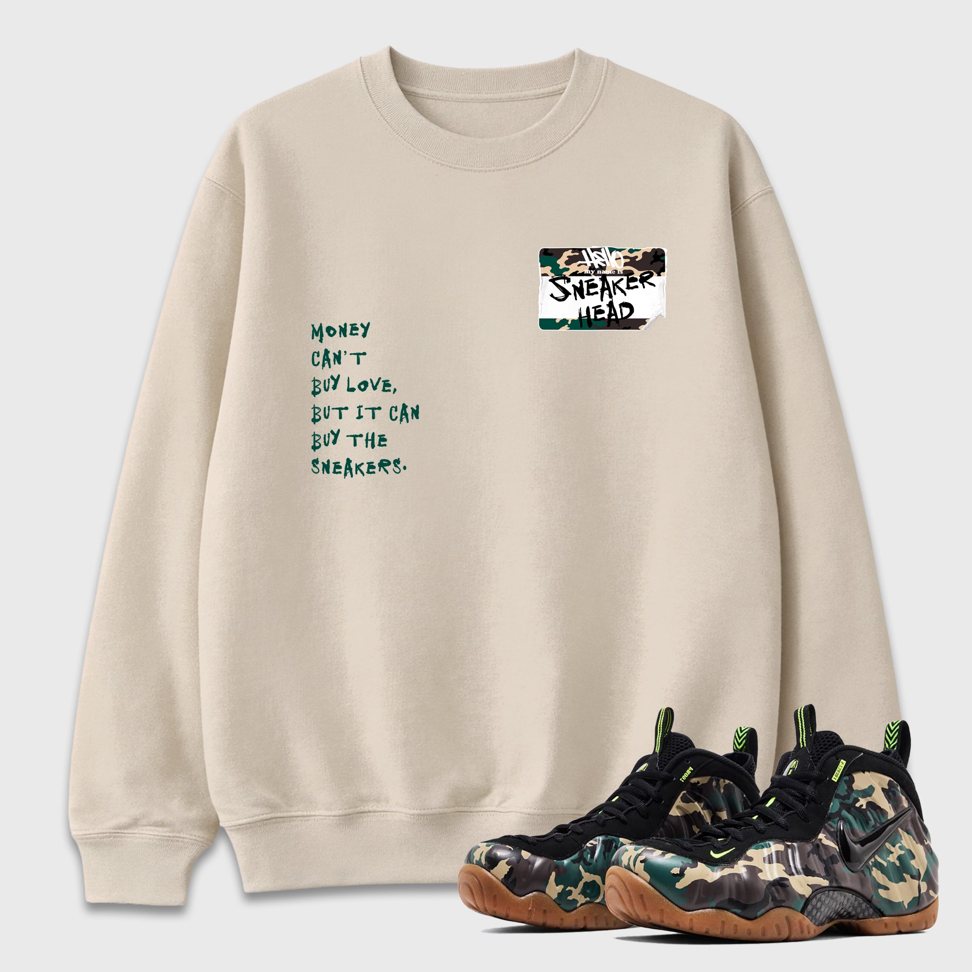 Sneakerhead Badge Graphic T-Shirt featuring original streetwear artwork designed to match the Air Foamposite Pro Green Camo. Natural 1 Graphic Tee.