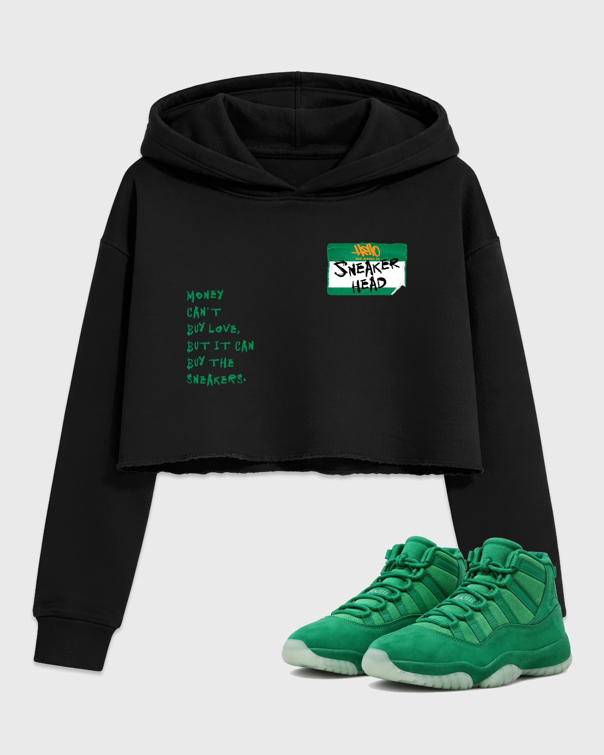 Sneakerhead Badge Women’s Graphic Crop Tee featuring original streetwear artwork designed to match the Air Jordan 11 Green Screen. Black 1 Crop Tee.