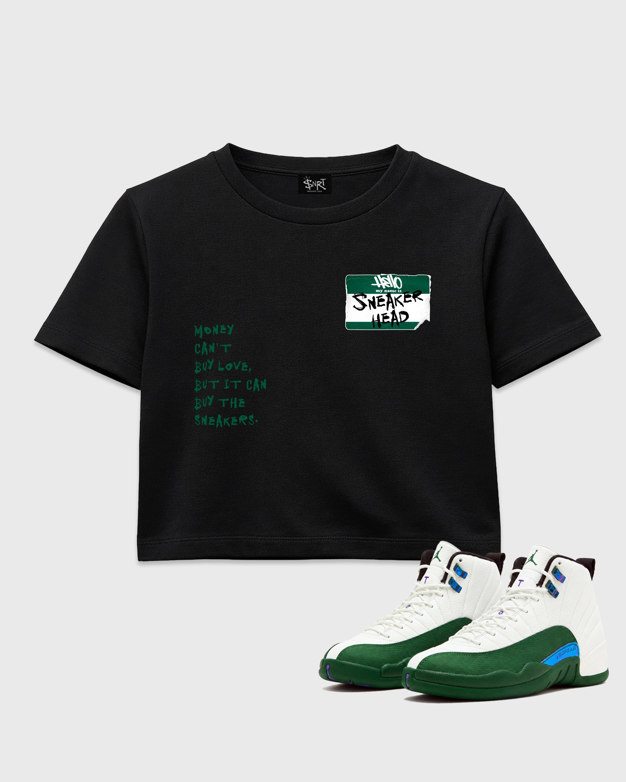 Sneakerhead Badge women’s crop tee designed to match the Air Jordan 12 Retro Bucks, featuring coordinated Black 1 options for a perfect streetwear vibe.