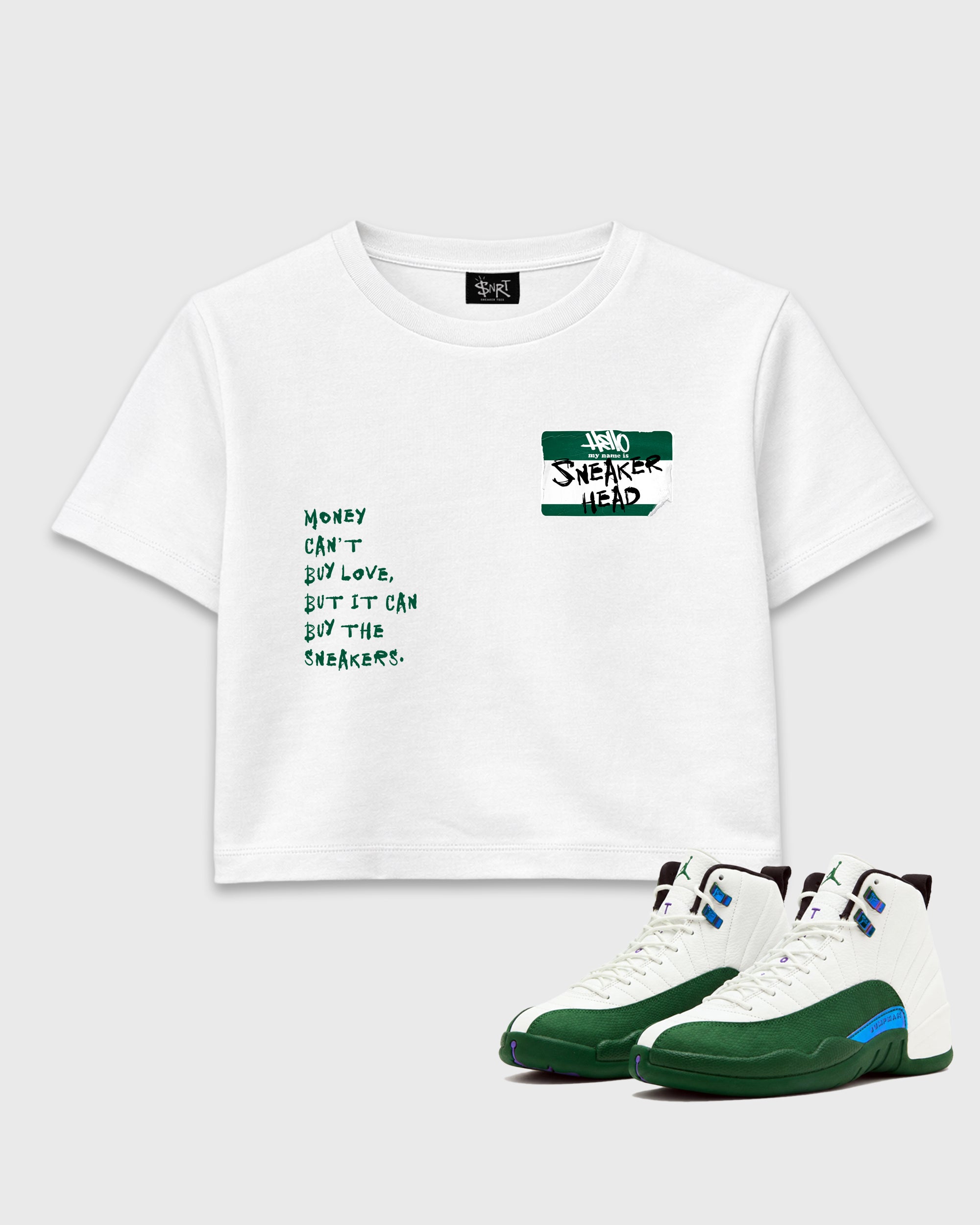 Sneakerhead Badge women’s crop tee designed to match the Air Jordan 12 Retro Bucks, featuring coordinated White 1 options for a perfect streetwear vibe.