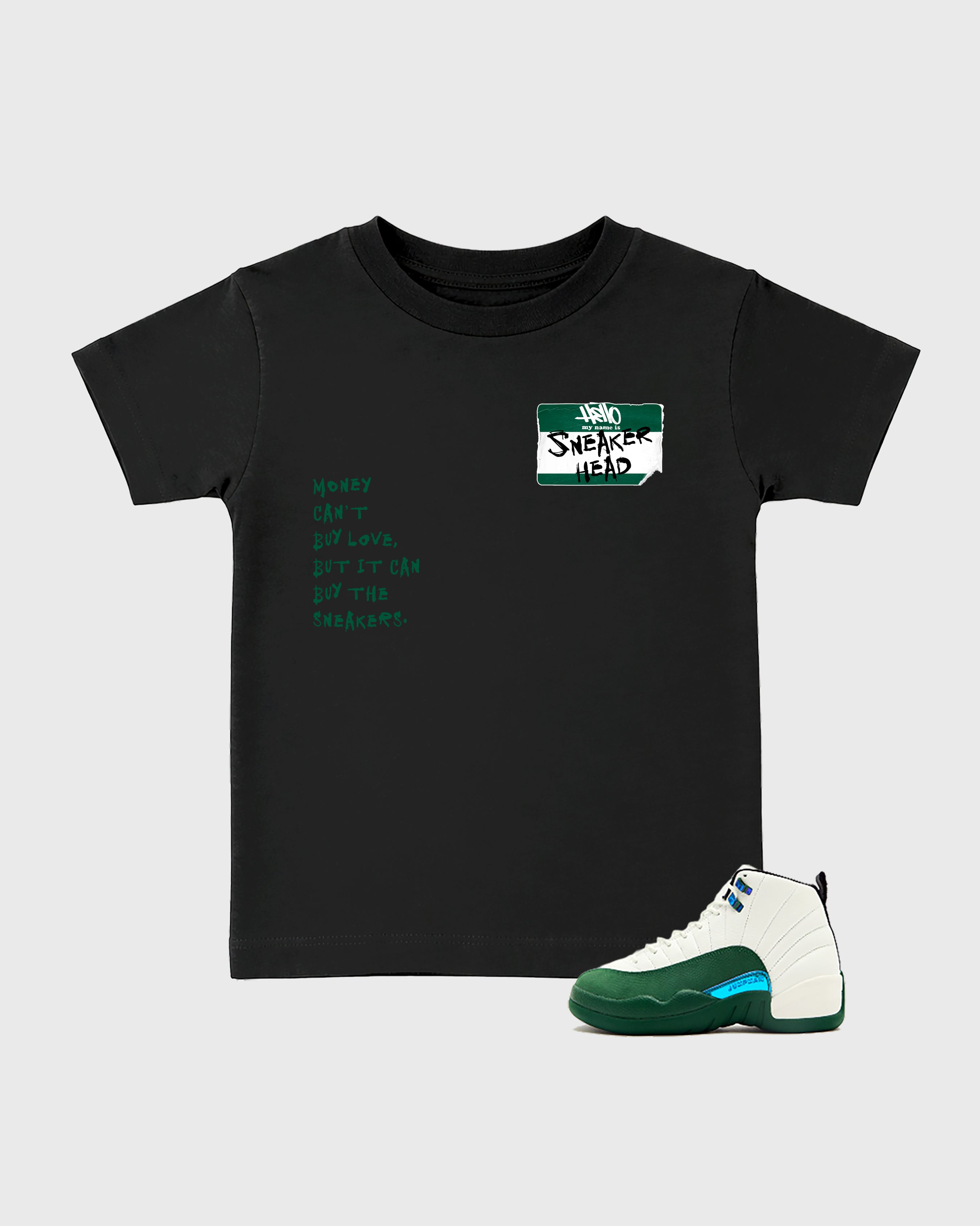 Sneakerhead Badge Baby & Kids Graphic T-Shirt featuring original artwork designed to match the Air Jordan 12 Retro Bucks. Black 1 Kids Graphic Tee.