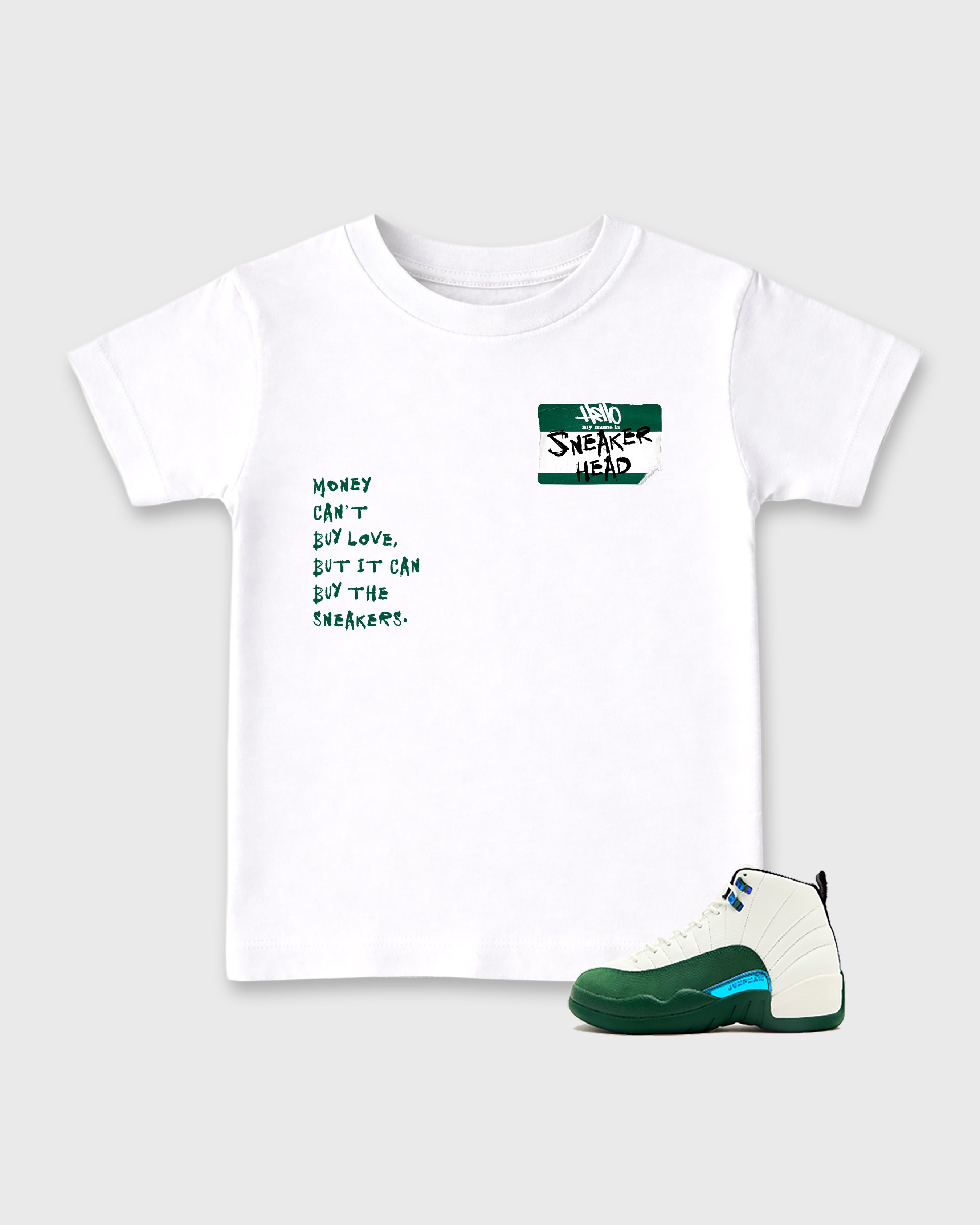 Sneakerhead Badge Baby & Kids Graphic T-Shirt featuring original artwork designed to match the Air Jordan 12 Retro Bucks. White 1 Kids Graphic Tee.