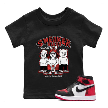 Sneakerheads Social Club baby and kids t-shirt crafted for little sneakerheads to shine with the Air Jordan 1 Ruby sneakers, displayed in Black 1.