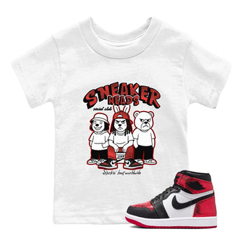 Sneakerheads Social Club baby and kids t-shirt crafted for little sneakerheads to shine with the Air Jordan 1 Ruby sneakers, displayed in White 1.