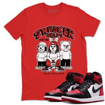 Sneakerheads Social Club sneaker match t-shirt styled to complete your fit with the Air Jordan 1 Ruby sneakers, shown in Red 1.