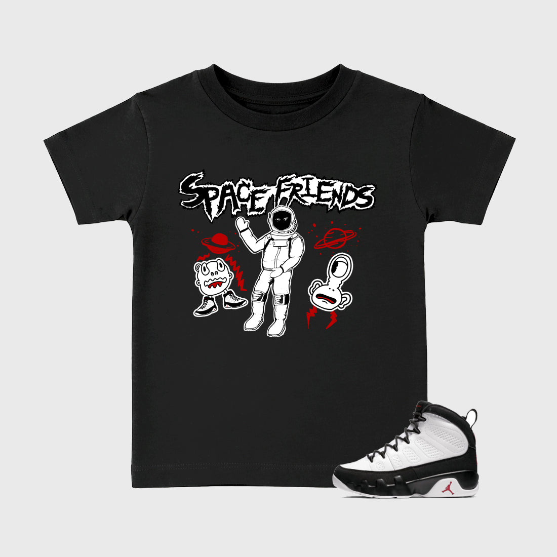 Space Friends Baby & Kids Graphic T-Shirt featuring original artwork designed to match the Air Jordan 9 True Red. Black 1 Kids Graphic Tee.