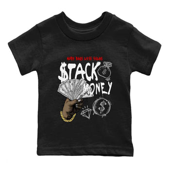 Stack Money baby and kids t-shirt crafted for little sneakerheads to shine with the Air Jordan 4 White Cement sneakers, displayed in Black 2.