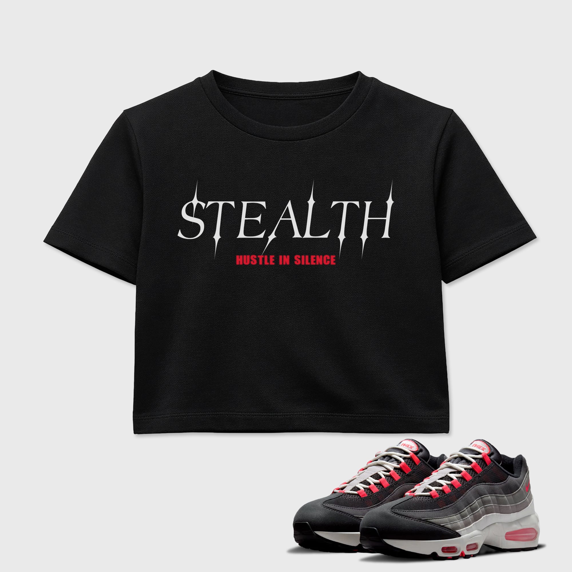 Stealth women’s crop tee designed to match the Air Max 95 Reverse Solar Red, featuring coordinated Black 1 options for a perfect streetwear vibe.