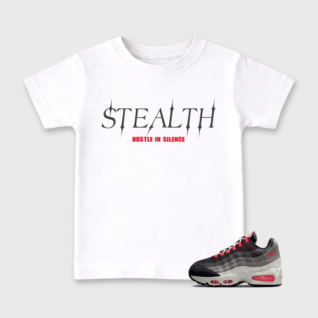 Stealth Baby & Kids Graphic T-Shirt featuring original artwork designed to match the Air Max 95 Reverse Solar Red. White 1 Kids Graphic Tee.