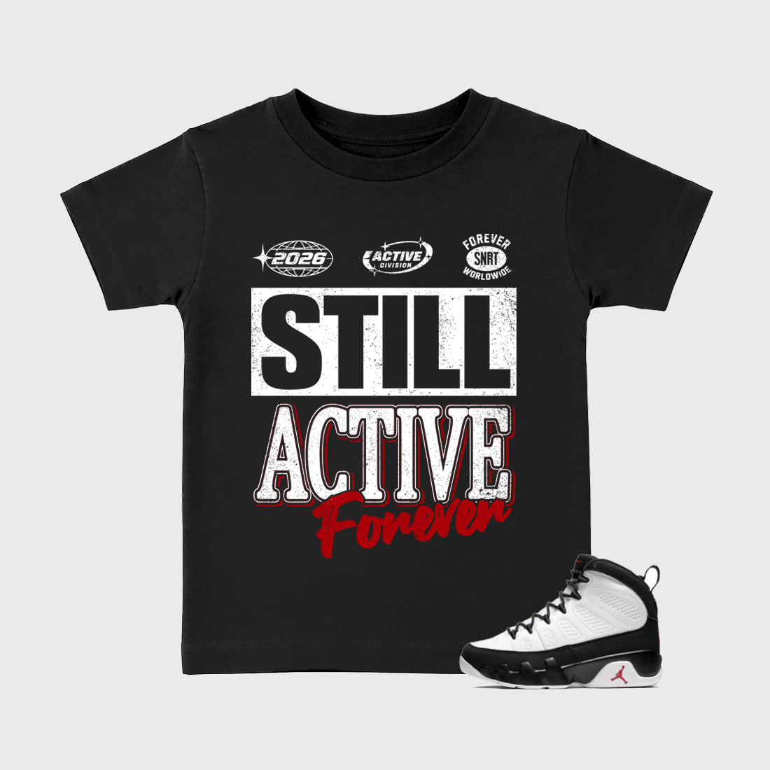 Still Active Baby & Kids Graphic T-Shirt featuring original artwork designed to match the Air Jordan 9 True Red. Black 1 Kids Graphic Tee.
