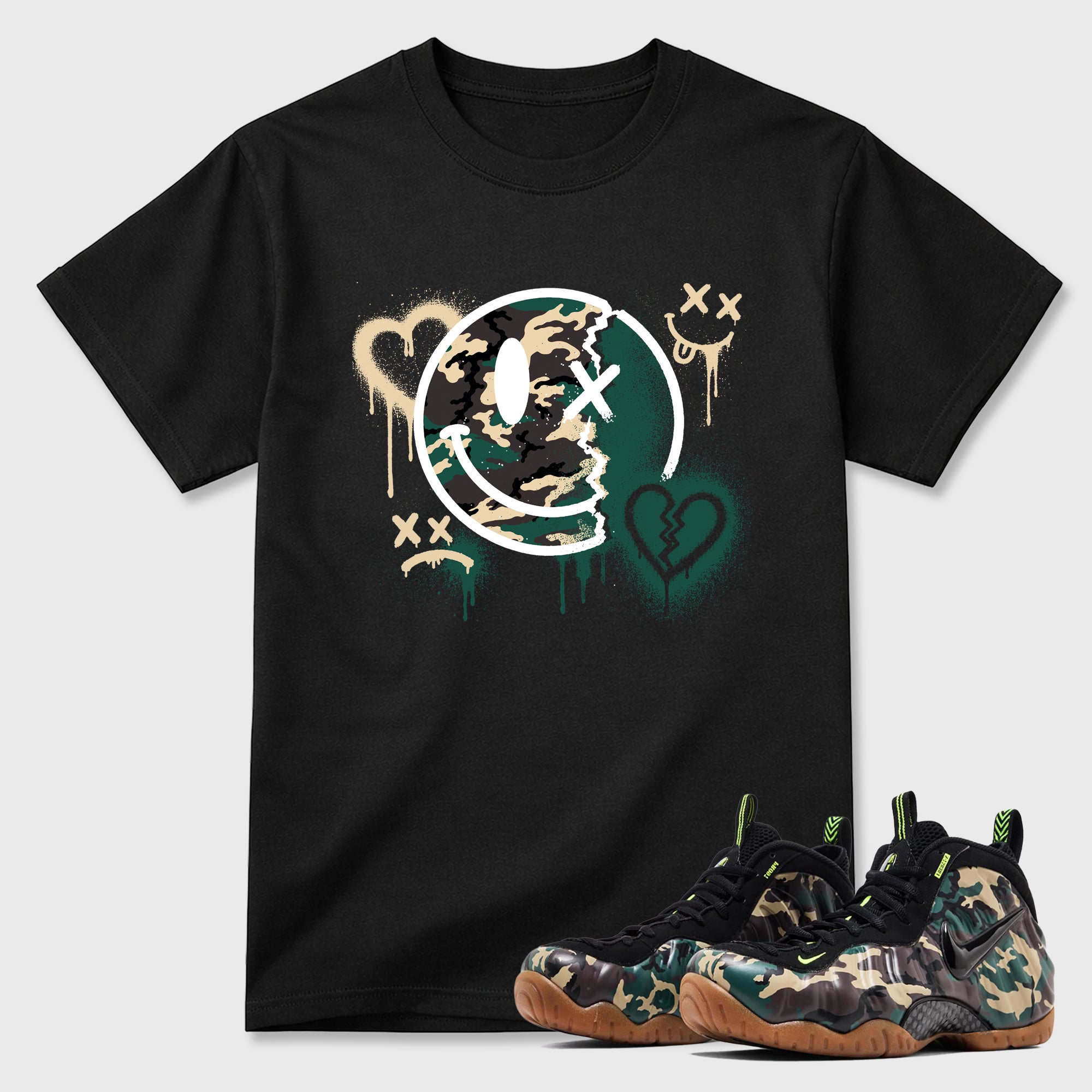 Sweet Damage Graphic T-Shirt featuring original streetwear artwork designed to match the Air Foamposite Pro Green Camo. Black 1 Graphic T-Shirt.