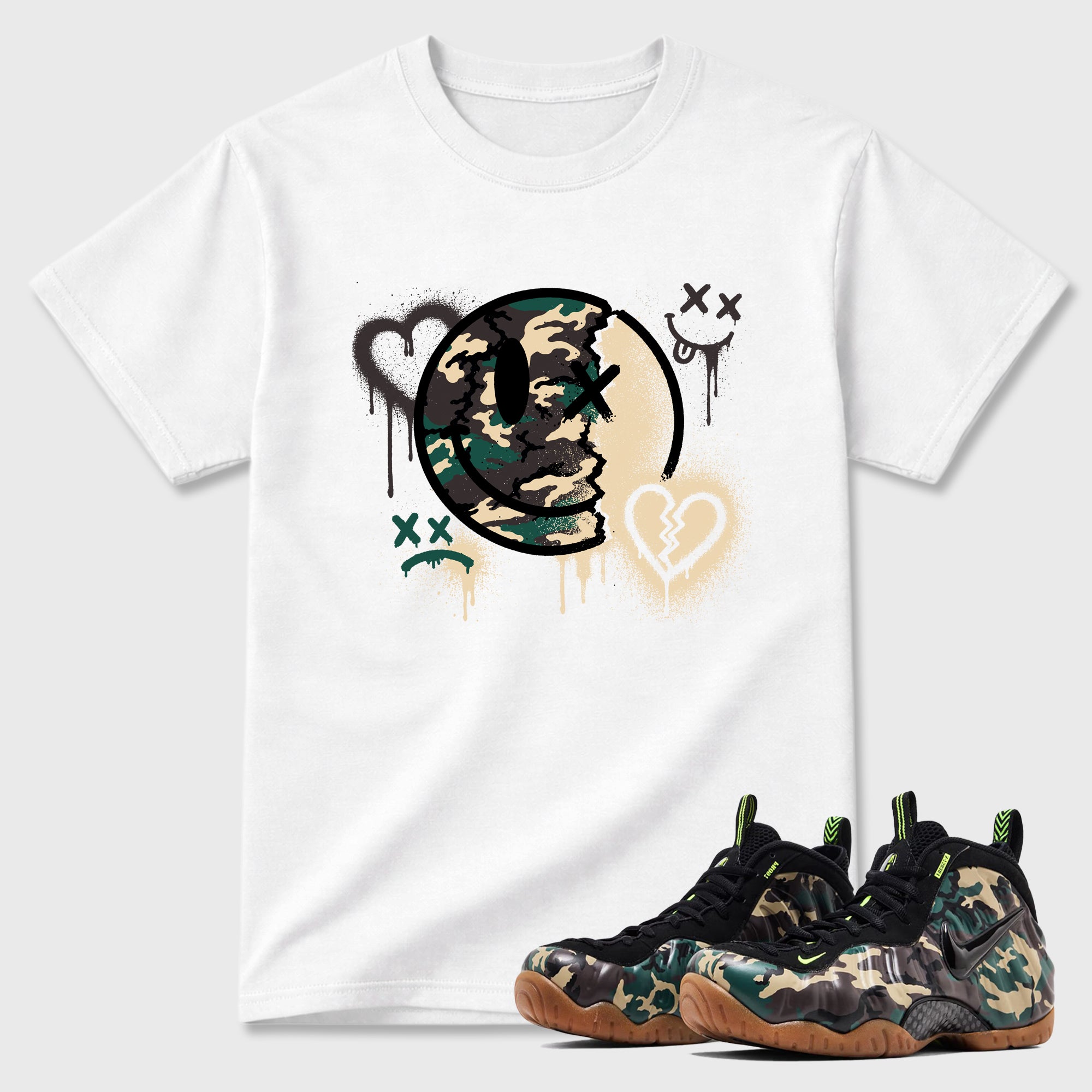Sweet Damage Graphic T-Shirt featuring original streetwear artwork designed to match the Air Foamposite Pro Green Camo. White 1 Graphic T-Shirt.
