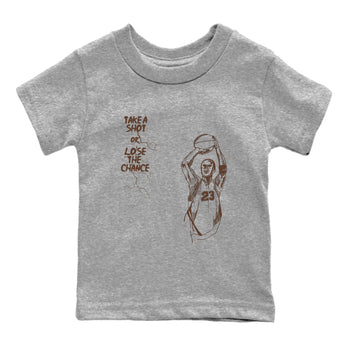 AJ12 Baroque Brown shirts to match jordans Take A Shot best t shirts to wear with jordans SoleFly x Jordan 12 Baroque Brown match shoes to clothes SNRT Sneaker Tees Youth Baby Heather Grey 2 tee