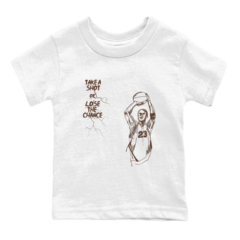 AJ12 Baroque Brown shirts to match jordans Take A Shot best t shirts to wear with jordans SoleFly x Jordan 12 Baroque Brown match shoes to clothes SNRT Sneaker Tees Youth Baby White 2 tee