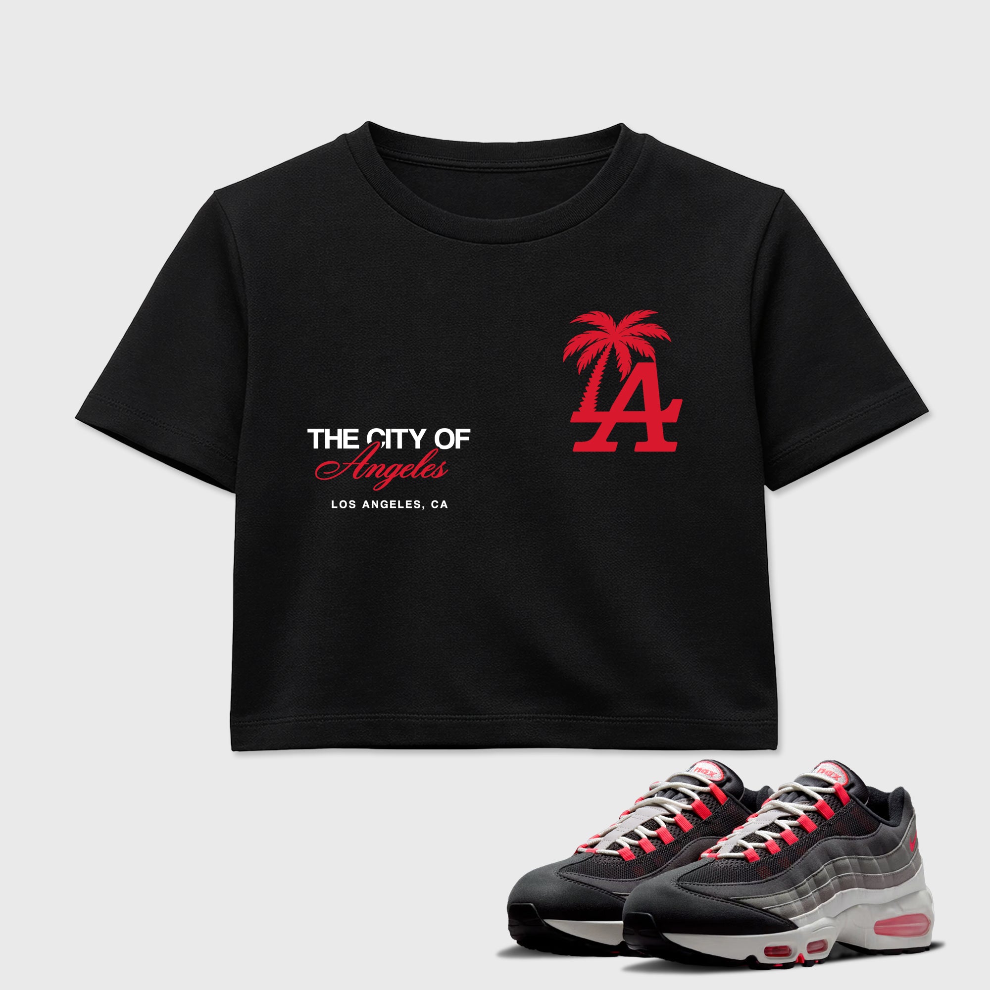 The City Of Angeles women’s crop tee designed to match the Air Max 95 Reverse Solar Red, featuring coordinated Black 1 options for a perfect streetwear vibe.