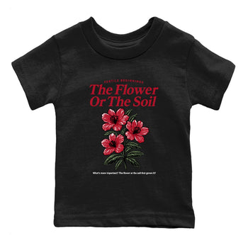 The Flower Or The Soil baby and kids t-shirt crafted for little sneakerheads to shine with the Air Jordan 1 Ruby sneakers, displayed in Black 2.