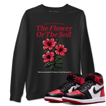 The Flower Or The Soil sneaker match t-shirt styled to complete your fit with the Air Jordan 1 Ruby sneakers, shown in Black 1.