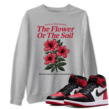 The Flower Or The Soil sneaker match t-shirt styled to complete your fit with the Air Jordan 1 Ruby sneakers, shown in Heather Grey 1.
