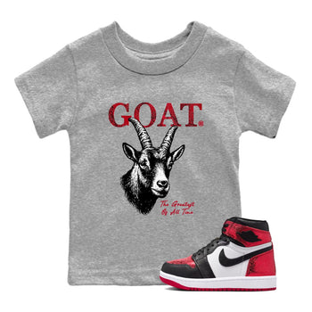 The Greatest Of All Time baby and kids t-shirt crafted for little sneakerheads to shine with the Air Jordan 1 Ruby sneakers, displayed in Heather Grey 1.