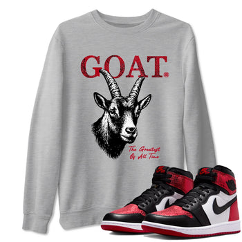 The Greatest Of All Time sneaker match t-shirt styled to complete your fit with the Air Jordan 1 Ruby sneakers, shown in Heather Grey 1.
