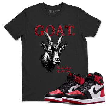 The Greatest Of All Time sneaker match t-shirt styled to complete your fit with the Air Jordan 1 Ruby sneakers, shown in Black 1.