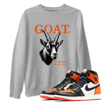 The Greatest Of All Time sneaker match t-shirt styled to complete your fit with the Air Jordan 1 Shattered Backboard sneakers, shown in Heather Grey 1.