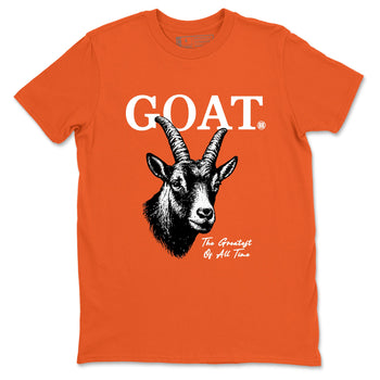 The Greatest Of All Time sneaker match t-shirt styled to complete your fit with the Air Jordan 1 Shattered Backboard sneakers, shown in Orange 2.