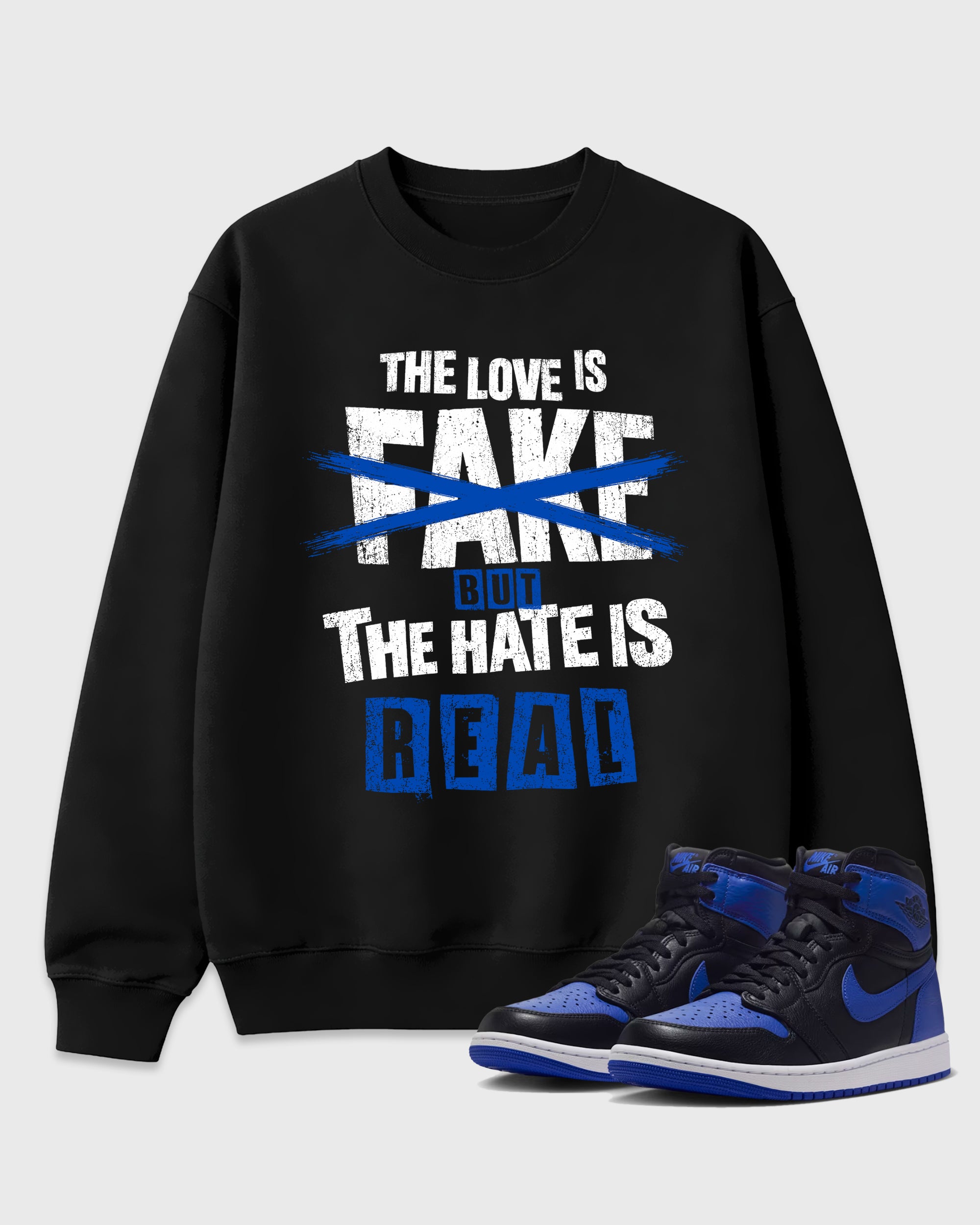 The Love is Fake But the Hate is Real Graphic T-Shirt featuring original streetwear artwork designed to match the Air Jordan 1 Royal. Black 1 Graphic Tee.