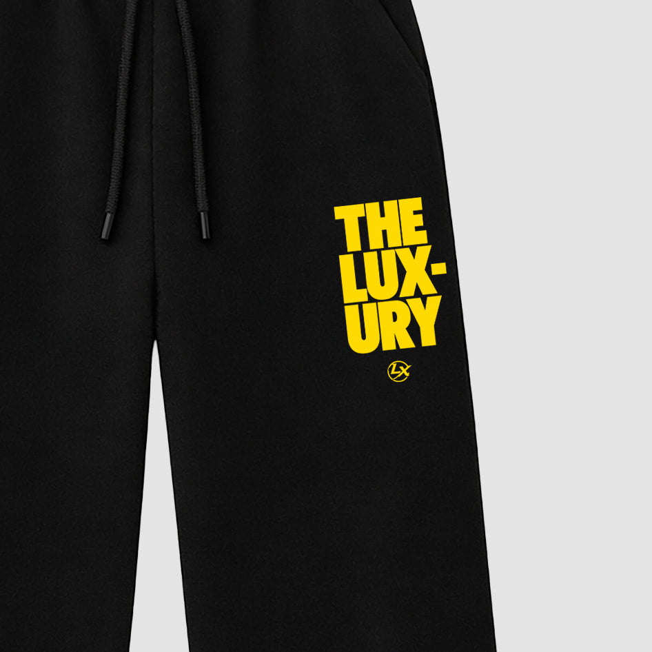 The Luxury graphic wide cut sweatpants designed to match the Air Jordan 4 Tour Yellow, featuring coordinated Black 2 options for a perfect streetwear vibe.