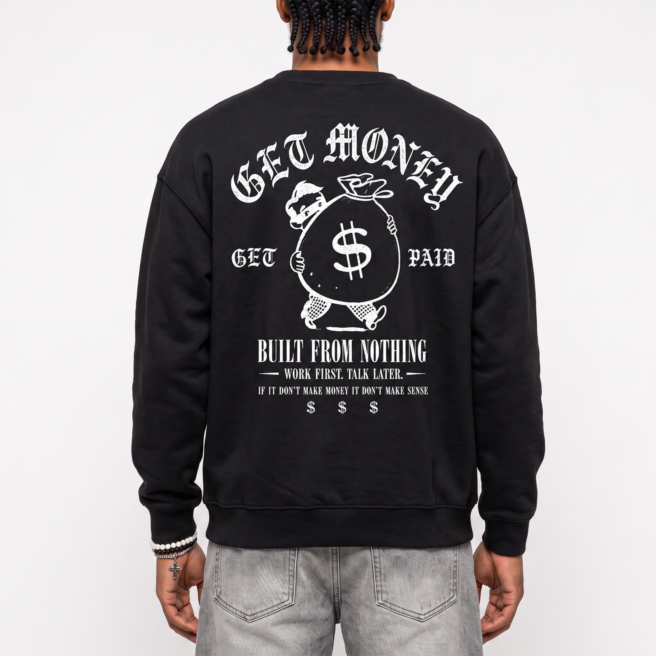 A person shown from the back wearing a black crewneck sweatshirt with a large white graphic print on the back, paired with light gray jeans, against a plain white background.