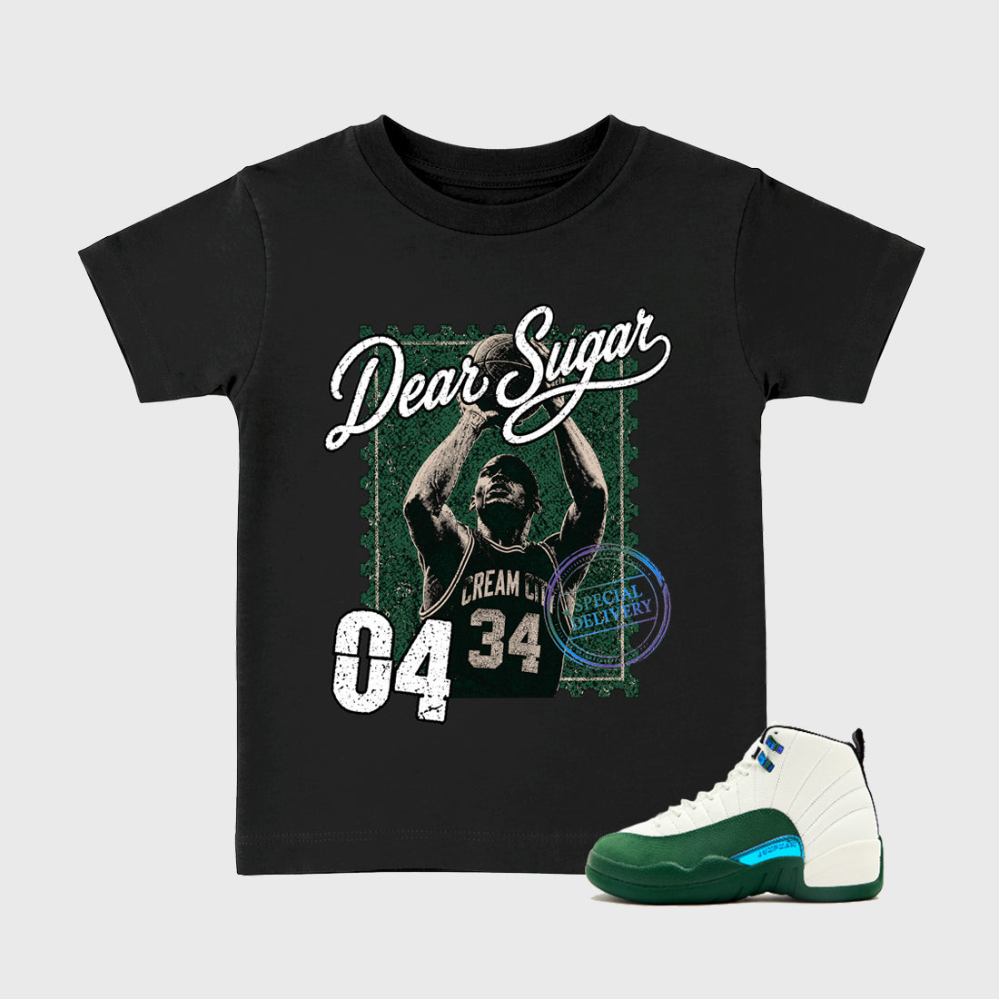 The Perfect Form Baby & Kids Graphic T-Shirt featuring original artwork designed to match the Air Jordan 12 Bucks. Black 1 Kids Graphic Tee.