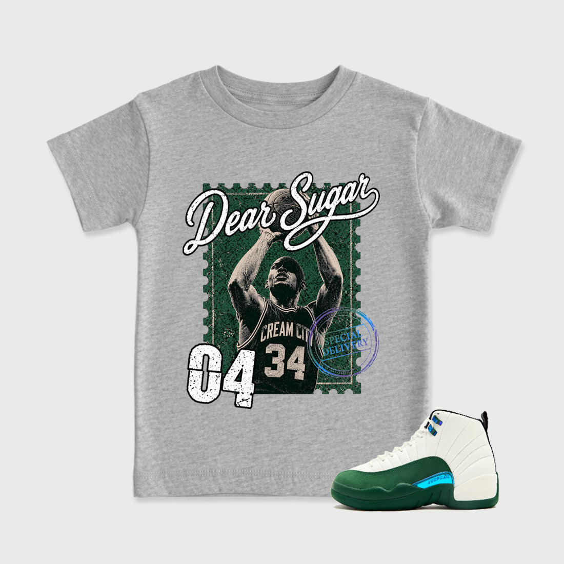 The Perfect Form Baby & Kids Graphic T-Shirt featuring original artwork designed to match the Air Jordan 12 Bucks. Heather Grey 1 Kids Graphic Tee.