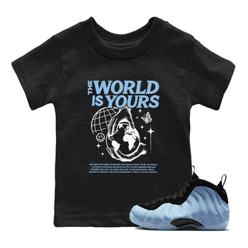 The World Is Yours baby and kids t-shirt crafted for little sneakerheads to shine with the Air Foamposite One Psychic Blue sneakers, displayed in Black 1.