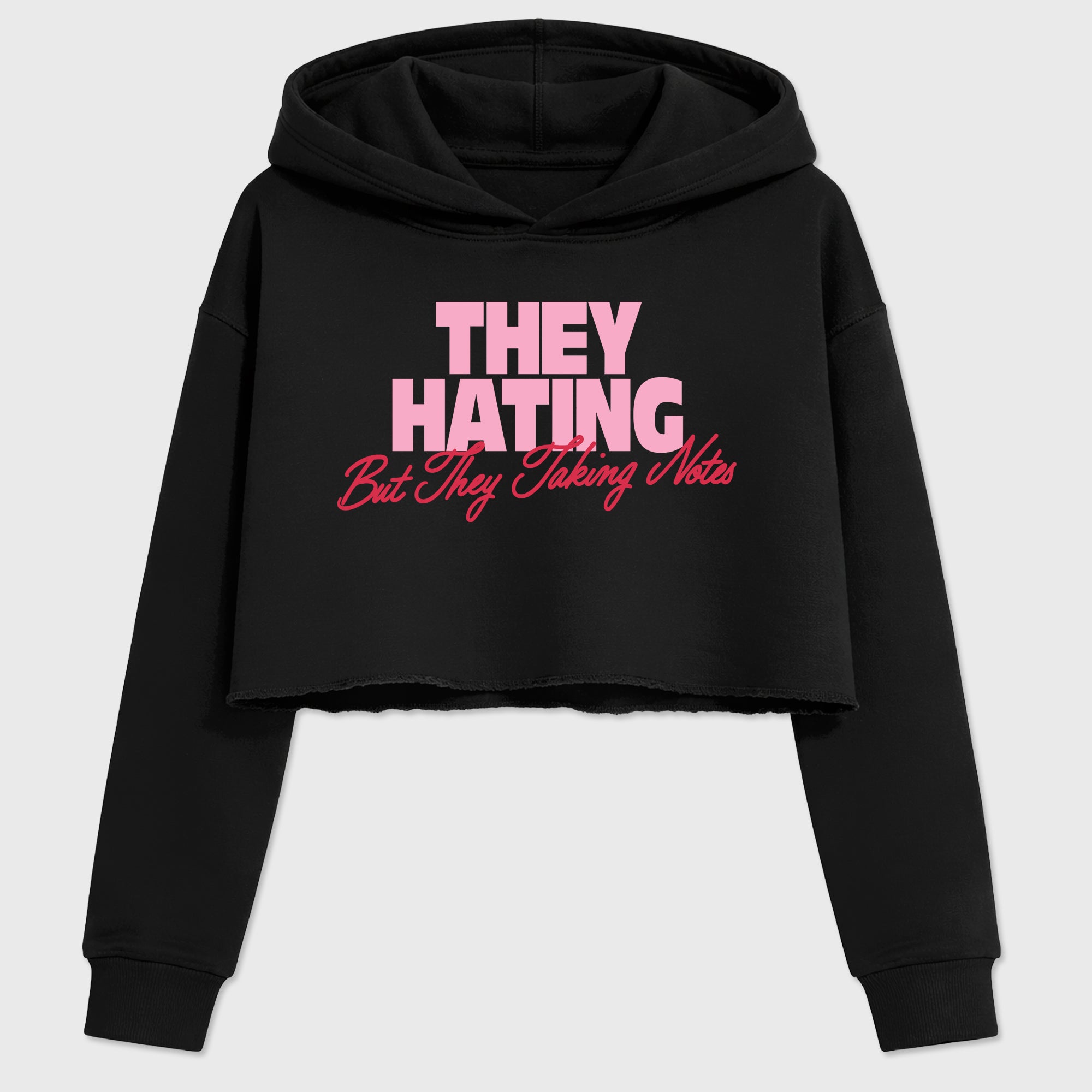 They Hating But Taking Notes women’s crop tee designed to match the Air Jordan 1 Travis Scott Tropical Pink, featuring coordinated Black 2 options for a perfect streetwear vibe.