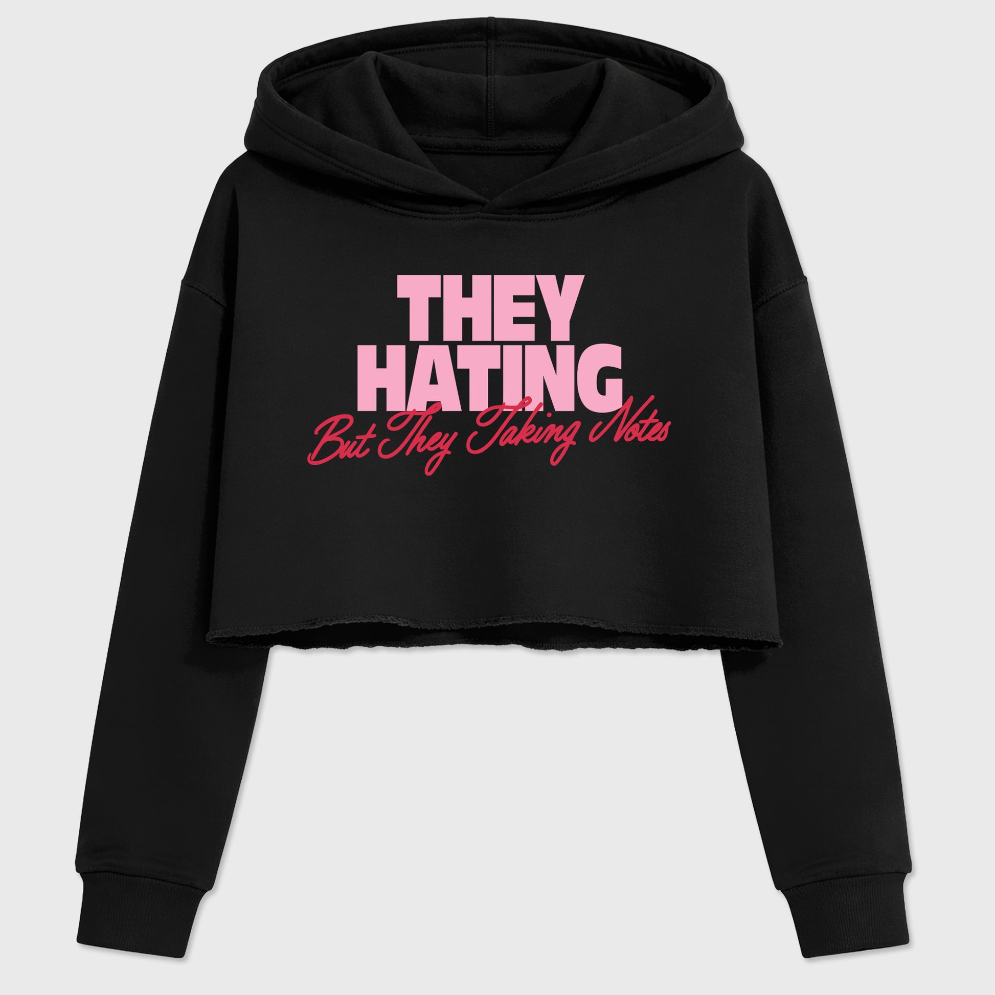 They Hating But Taking Notes women’s crop tee designed to match the Air Jordan 1 Travis Scott Tropical Pink, featuring coordinated Black 2 options for a perfect streetwear vibe.